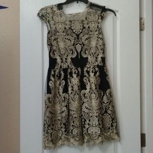 Black and gold lace dress